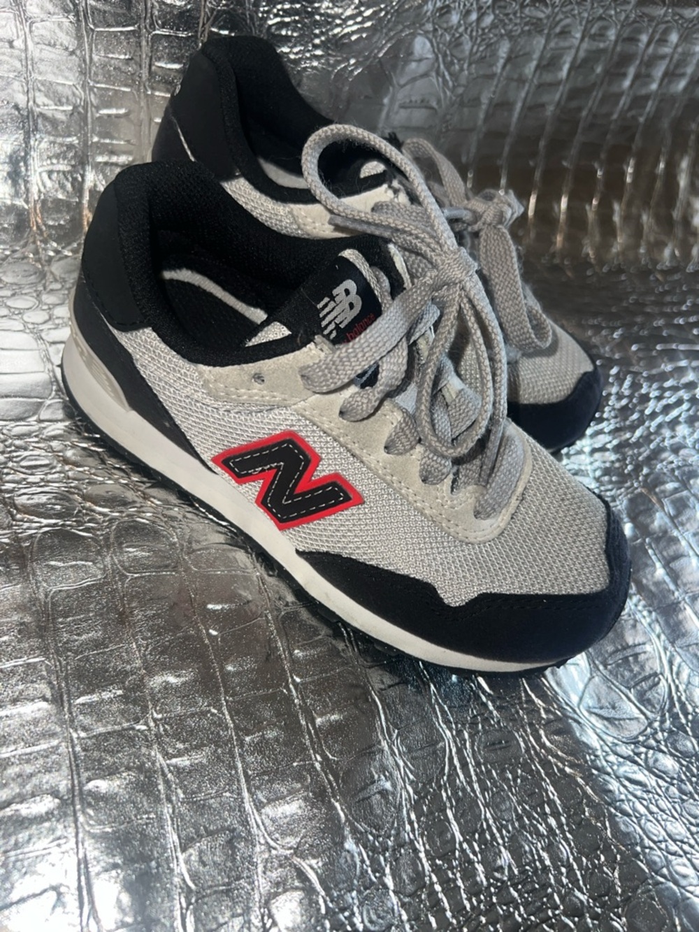 New Balance Kids Gray and Black Sneakers with Red 'N'
